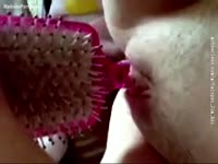 Japanese teen fucks herself with a hairbrush
